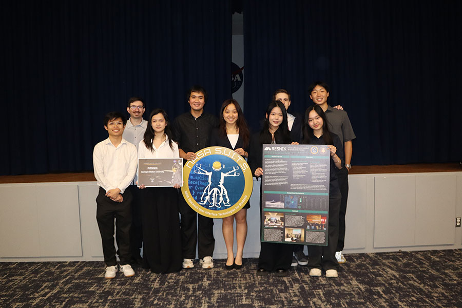 Group shot of the students on Team Resnik, holding their poster and the NASA SUITS seal.